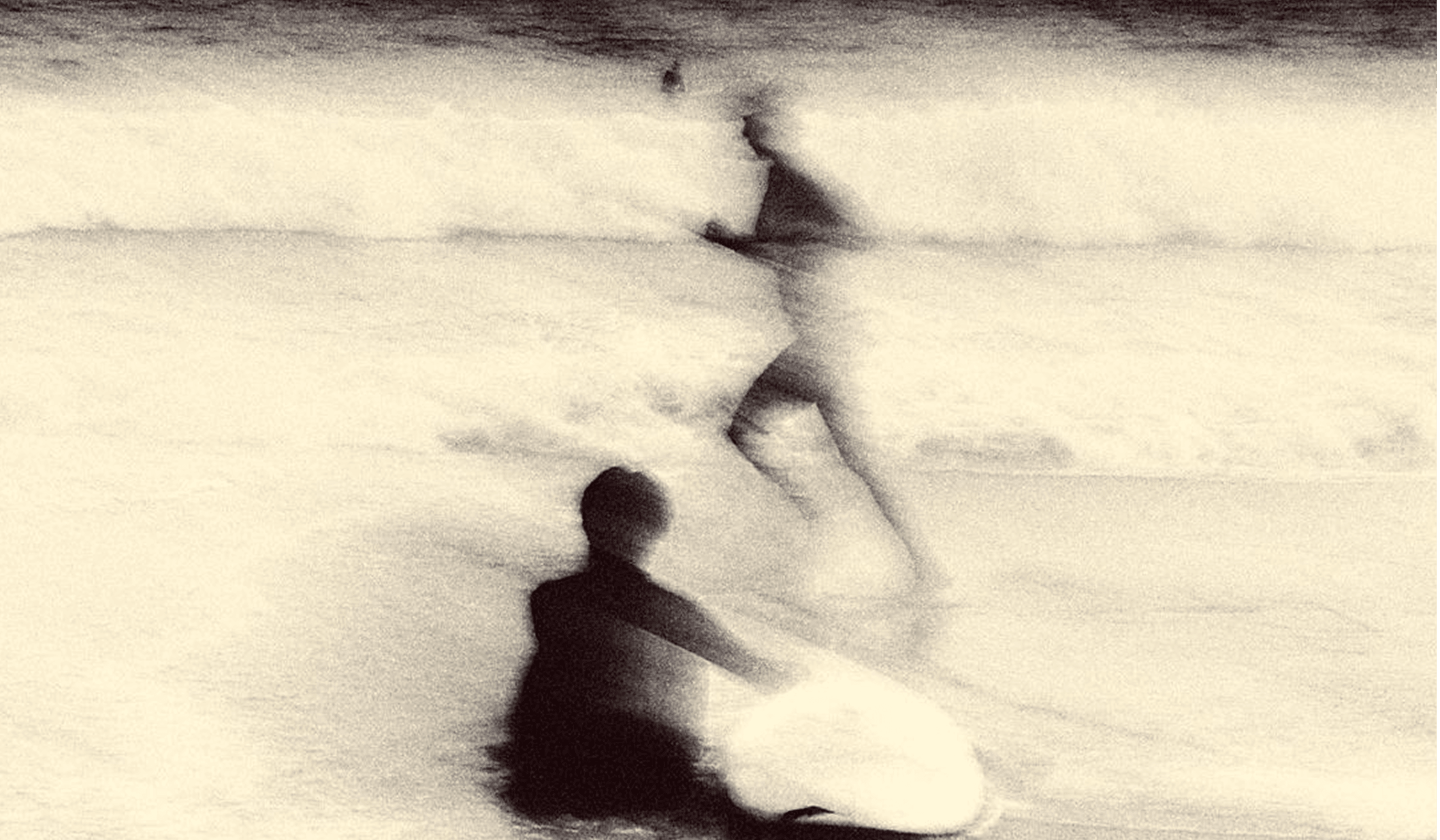 Artistic black and white photograph with blurred figures